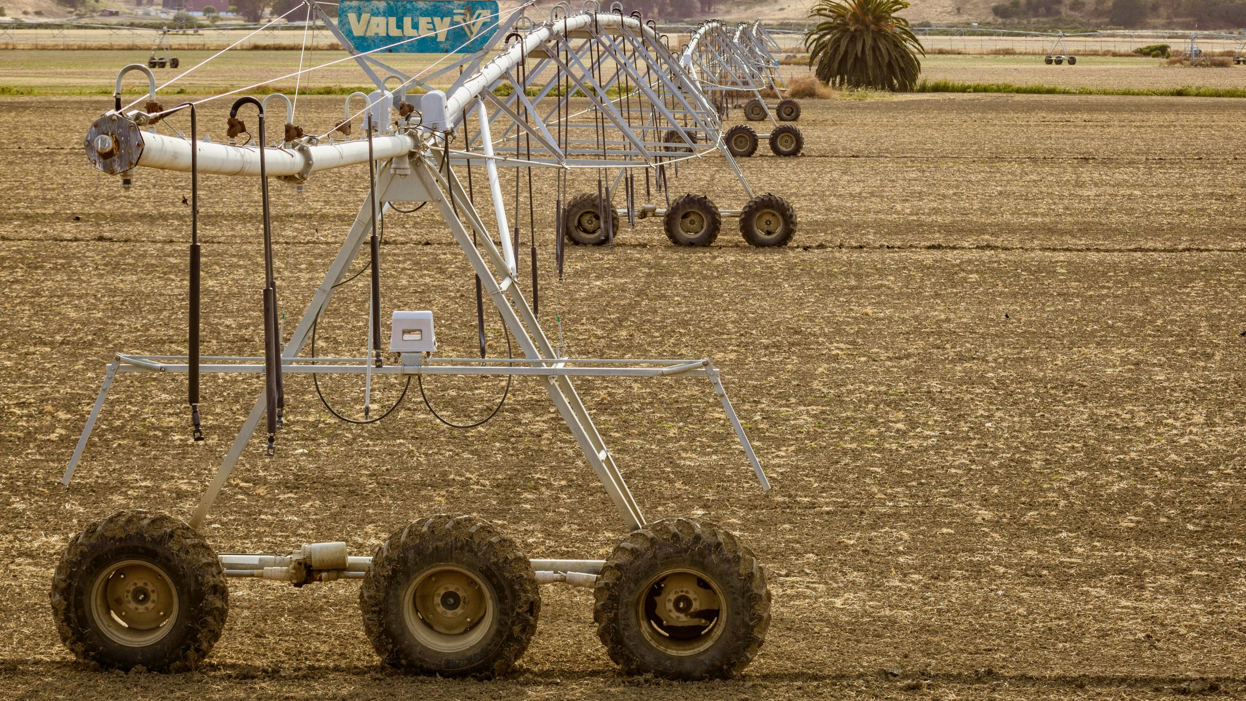 Photo of a lateral line Agricultural Sprinklers on a Farm Field